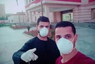 صورة محمد وكيرولس يد واحدة ضد فيروس كورونا المستجد “Covid_19”